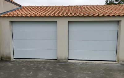 Résultat final de la rénovation des portes de garage sectionnelle sous plafond - Nant'Artisans